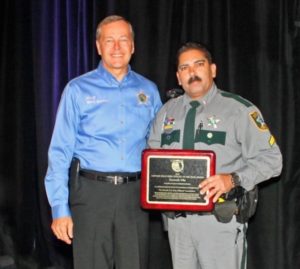 Collier County Sheriff Kevin Rambosk, left, presented Cpl. Ken Vila with the 2015 Florida D.A.R.E. Officer of the Year award Monday in Orlando. In August, Cpl. Vila will travel to New Orleans where he will be honored by D.A.R.E. America with the 2015 National D.A.R.E. Officer of the Year award. Photo by Cpl. Debra Gross/CCSO 